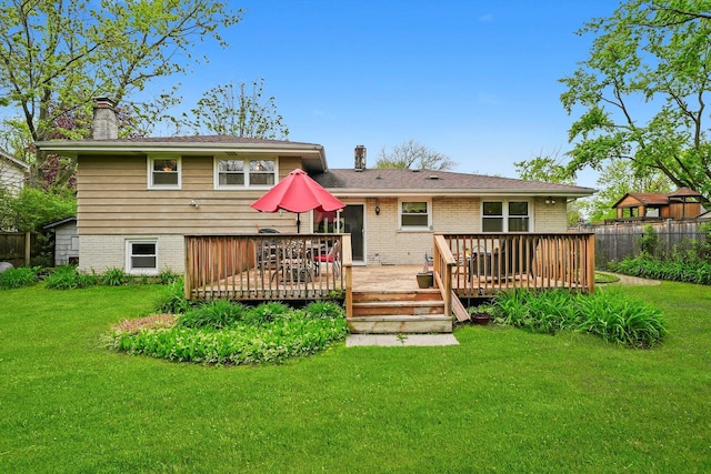 7513 Rohrer Dr, Downers Grove, IL 60516 - rear view of house with brick siding, a yard, a chimney, and a wooden deck
