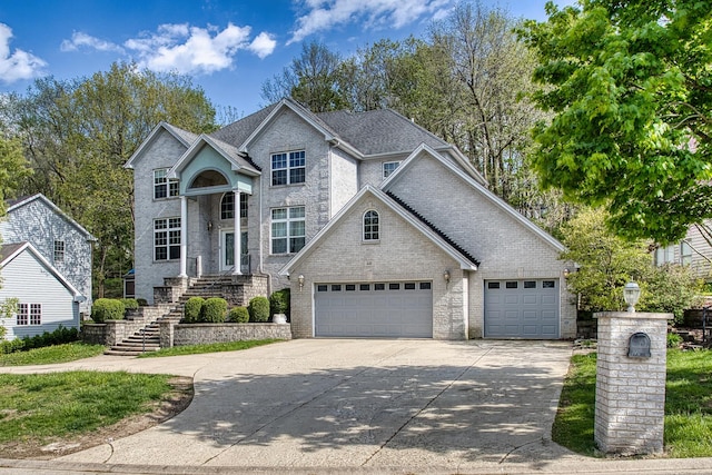 440 Delaware Cir, Bolingbrook, IL 60440 - traditional home with concrete driveway, stairway, and brick siding