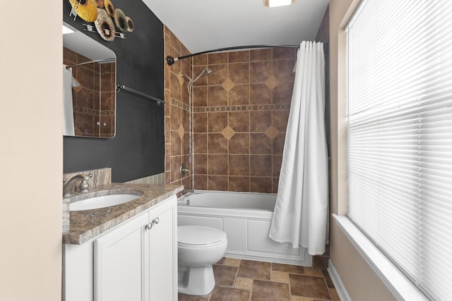 440 Delaware Cir, Bolingbrook, IL 60440 - bathroom featuring shower / bath combo, vanity, healthy amount of natural light, and stone finish floors