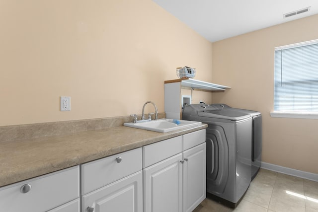 440 Delaware Cir, Bolingbrook, IL 60440 - laundry area with washer and dryer, cabinet space, and light tile patterned floors