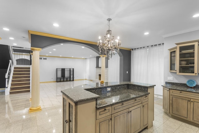 440 Delaware Cir, Bolingbrook, IL 60440 - kitchen with arched walkways, decorative columns, crown molding, recessed lighting, and glass insert cabinets
