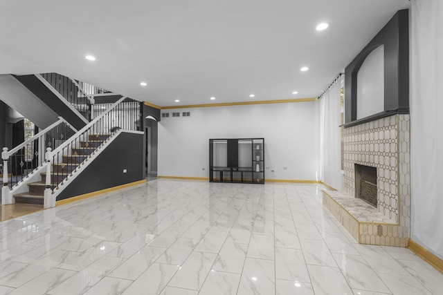 440 Delaware Cir, Bolingbrook, IL 60440 - unfurnished living room featuring stairs, plenty of natural light, recessed lighting, marble finish floors, and a fireplace