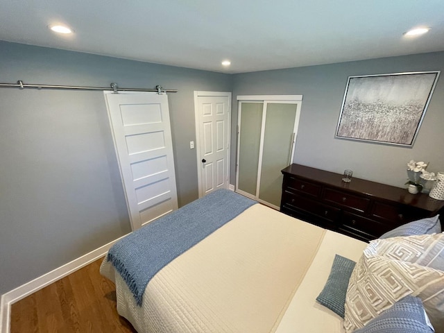 443 Indianwood Dr, Carol Stream, IL 60188 - bedroom featuring wood finished floors, a barn door, baseboards, and recessed lighting