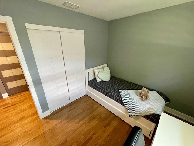 443 Indianwood Dr, Carol Stream, IL 60188 - bedroom with wood finished floors, a closet, and baseboards