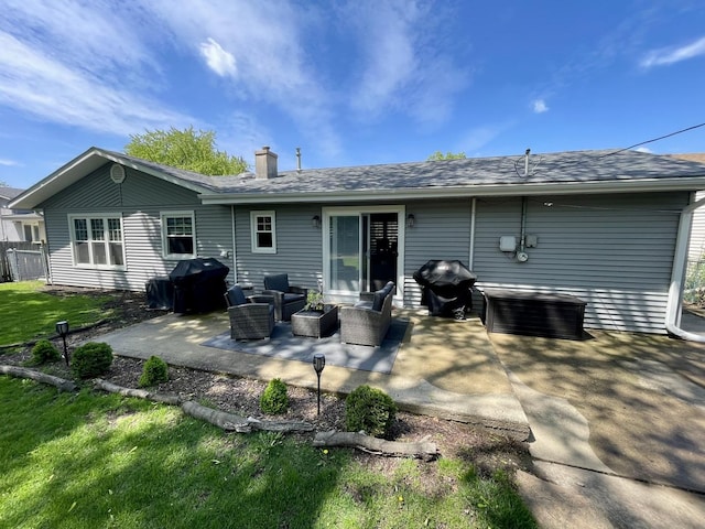 443 Indianwood Dr, Carol Stream, IL 60188 - back of house with a chimney, a patio area, an outdoor living space, and a shingled roof