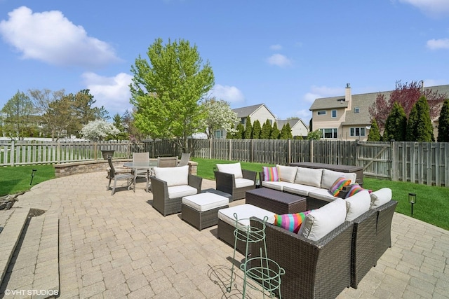 view of patio featuring an outdoor living space, a fenced backyard, and outdoor dining area