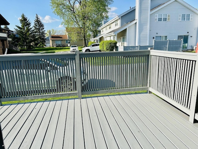 wooden deck featuring a residential view
