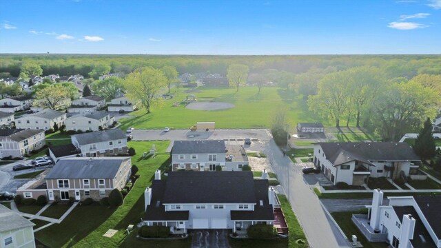 aerial perspective of suburban area featuring a forest