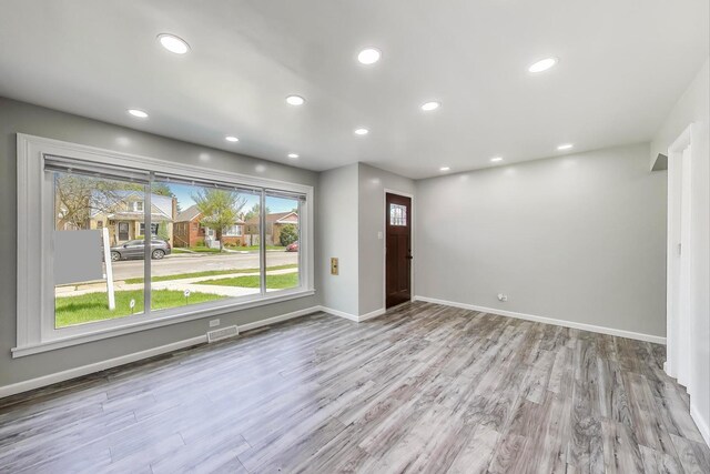 foyer with baseboards, recessed lighting, and wood finished floors