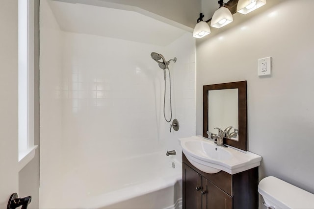 bathroom with vanity, toilet, and bathing tub / shower combination