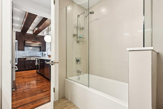 3940 N Ashland Ave Unit 2N, Chicago, IL 60613 - bathroom featuring wood finished floors, bathing tub / shower combination, tasteful backsplash, beam ceiling, and vanity
