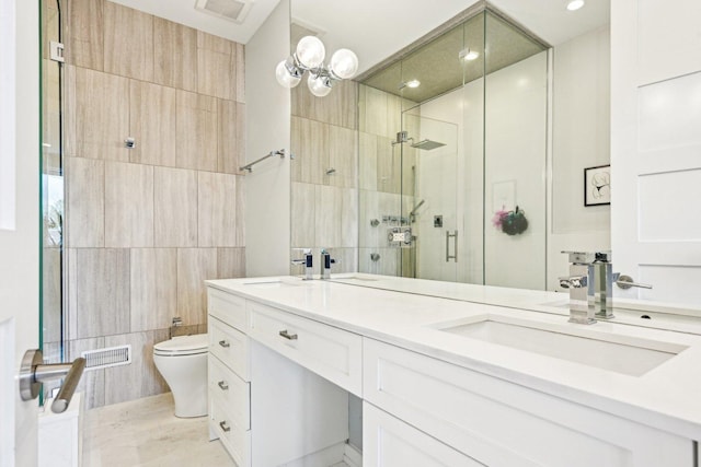 3940 N Ashland Ave Unit 2N, Chicago, IL 60613 - bathroom featuring a stall shower, toilet, tile walls, and double vanity