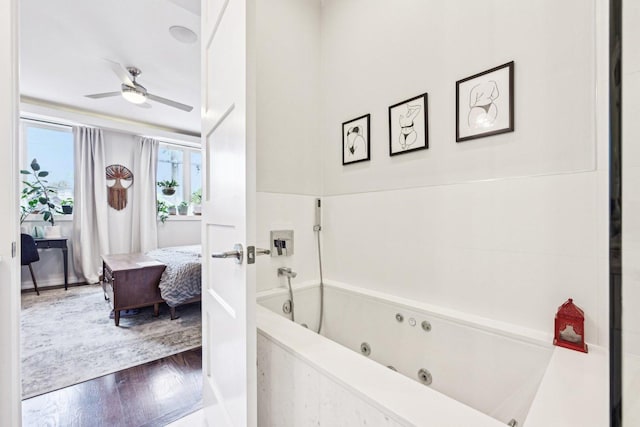 3940 N Ashland Ave Unit 2N, Chicago, IL 60613 - bathroom with wood finished floors, ensuite bathroom, ceiling fan, and a jetted tub