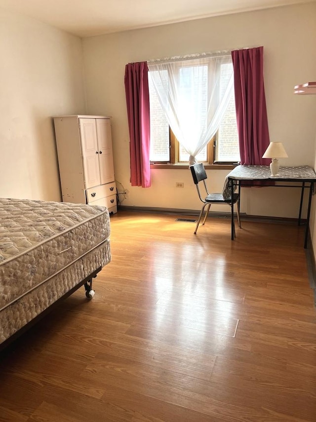 bedroom featuring wood finished floors