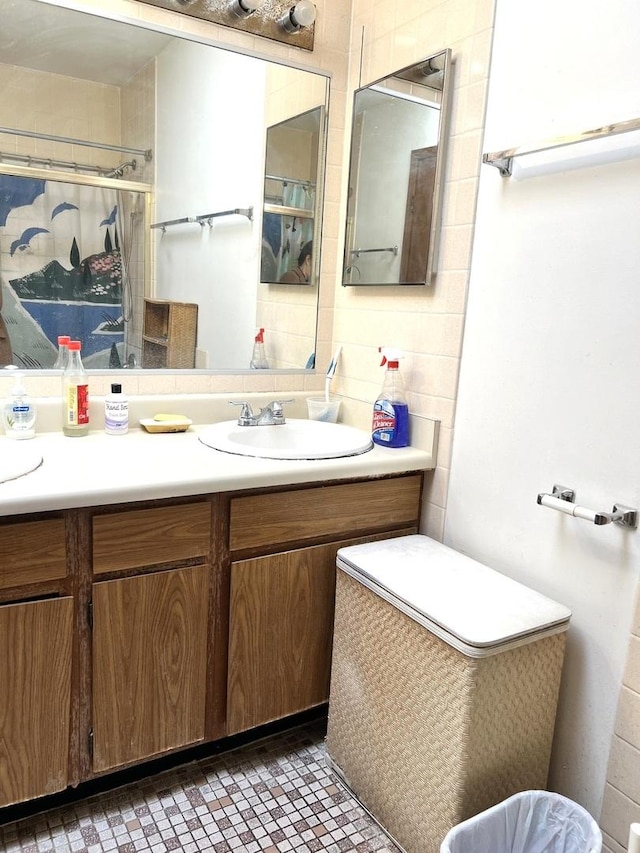 full bathroom with vanity and a shower with shower curtain