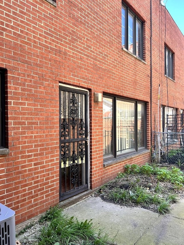 property entrance with brick siding