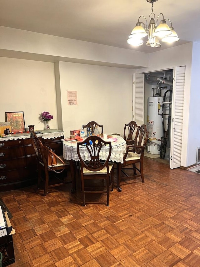 dining space featuring water heater and a chandelier