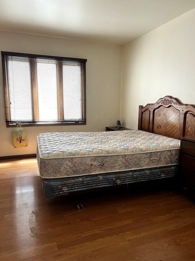 bedroom featuring wood finished floors