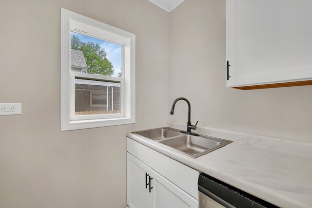 622 E Joliet St, Ottawa, IL 61350 - kitchen with a sink, dishwasher, white cabinetry, and light countertops