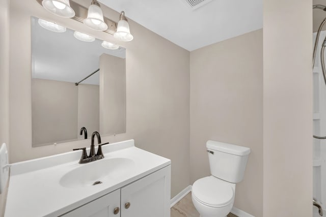 622 E Joliet St, Ottawa, IL 61350 - bathroom with vanity, toilet, and baseboards