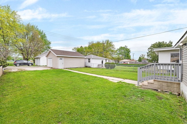 622 E Joliet St, Ottawa, IL 61350 - view of yard featuring a garage, driveway, and an outdoor structure