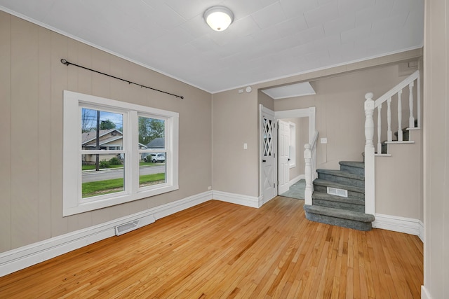 622 E Joliet St, Ottawa, IL 61350 - foyer with light wood-type flooring, ornamental molding, stairs, and baseboards