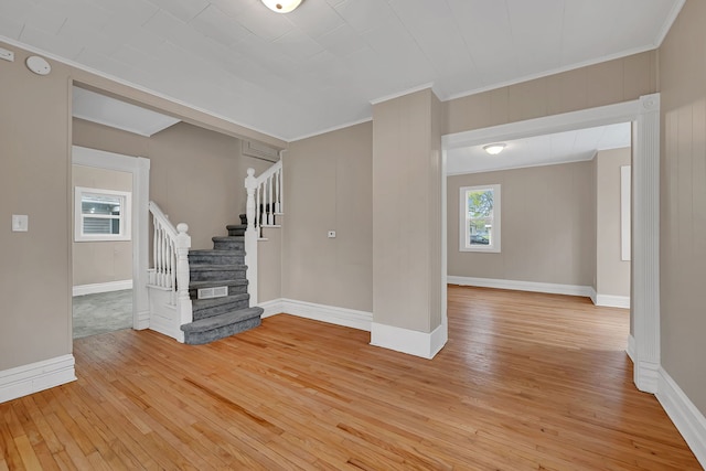 622 E Joliet St, Ottawa, IL 61350 - unfurnished living room with light wood-style flooring, stairs, ornamental molding, and baseboards