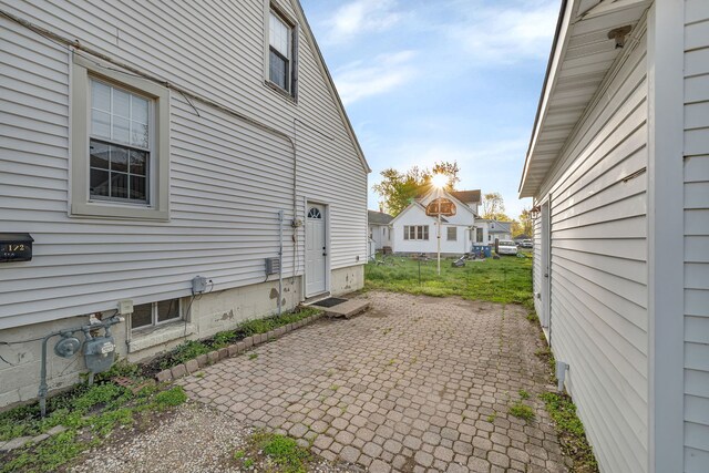 view of side of property featuring a patio