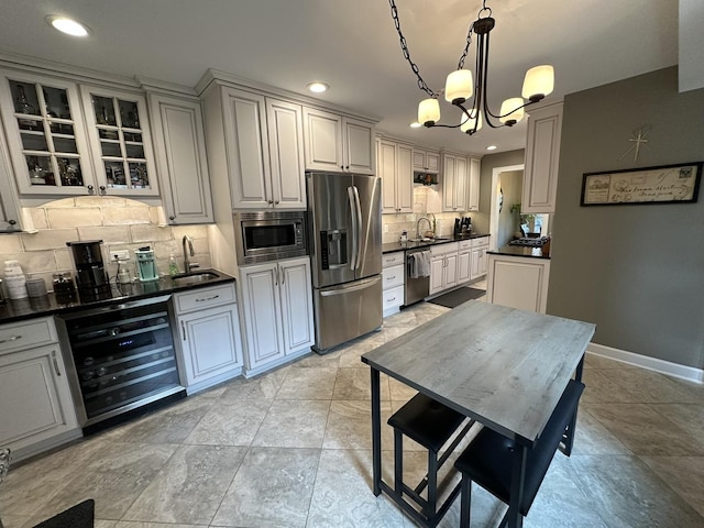14609 Morningside Rd, Orland Park, IL 60462 - kitchen with stainless steel appliances, wine cooler, a sink, dark countertops, and recessed lighting