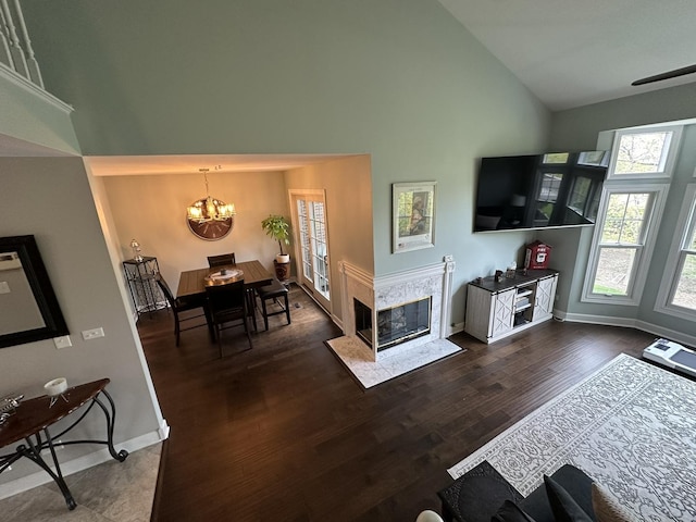 14609 Morningside Rd, Orland Park, IL 60462 - living area featuring high vaulted ceiling, a chandelier, healthy amount of natural light, wood finished floors, and baseboards