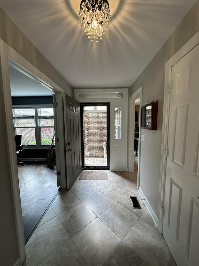 14609 Morningside Rd, Orland Park, IL 60462 - foyer entrance featuring a chandelier and baseboards