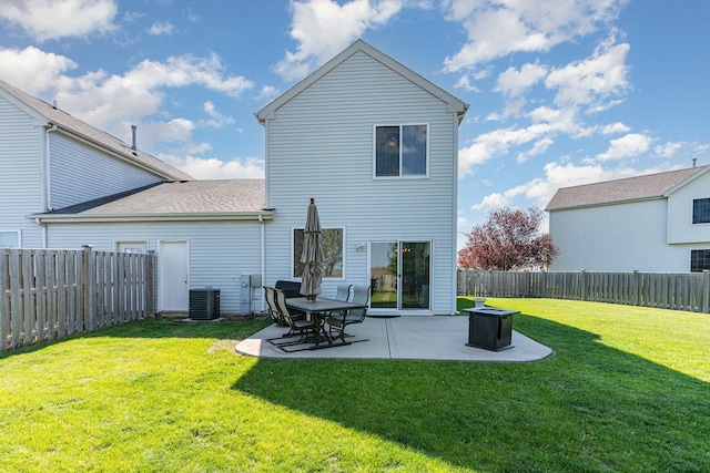 back of house with a patio area and central AC