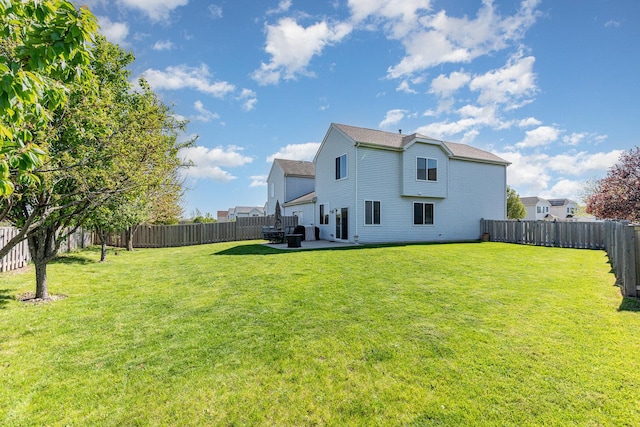 rear view of property featuring a patio area