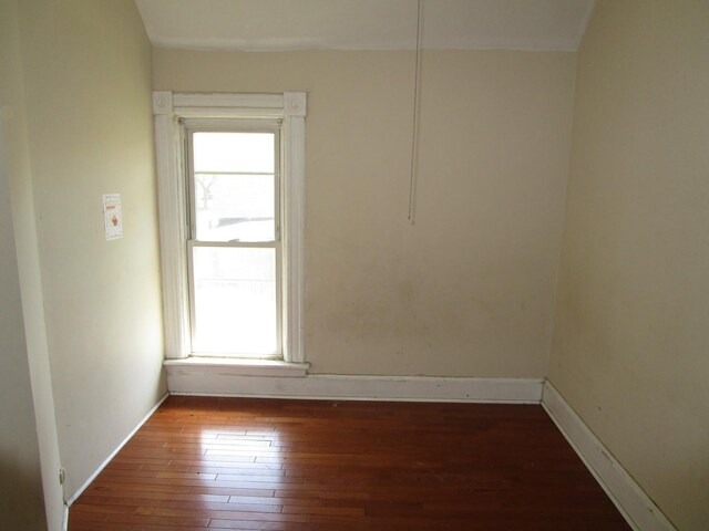 8742 S Racine Ave, Chicago, IL 60620 - empty room with healthy amount of natural light, hardwood / wood-style floors, and baseboards
