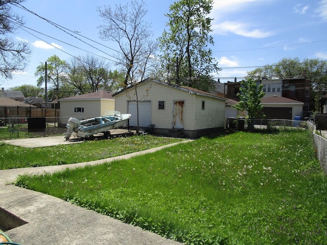 8742 S Racine Ave, Chicago, IL 60620 - view of side of property with a garage and an outbuilding
