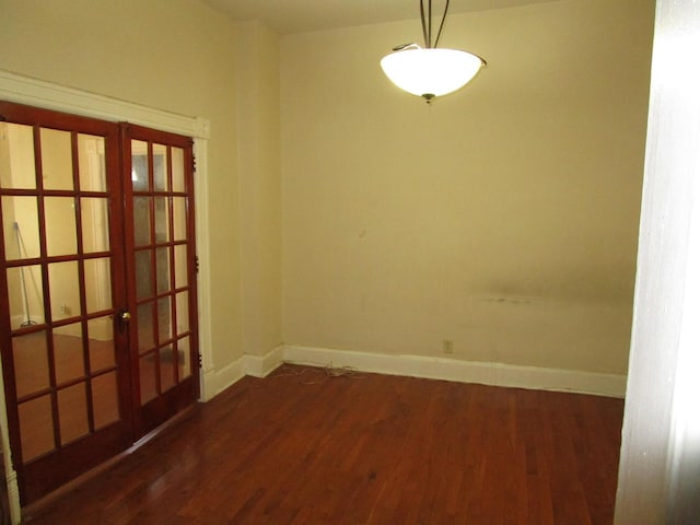 8742 S Racine Ave, Chicago, IL 60620 - unfurnished room featuring french doors, baseboards, and wood finished floors