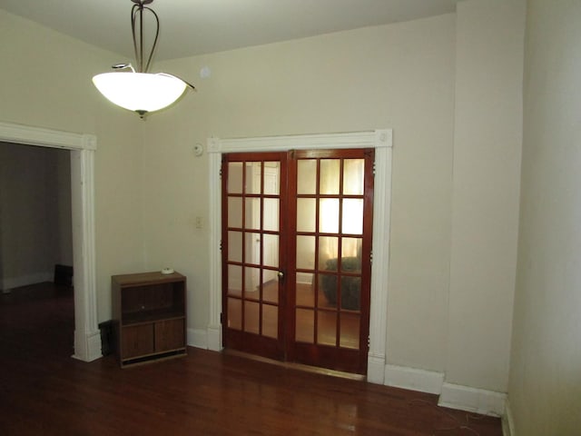 8742 S Racine Ave, Chicago, IL 60620 - empty room featuring wood finished floors, baseboards, and french doors