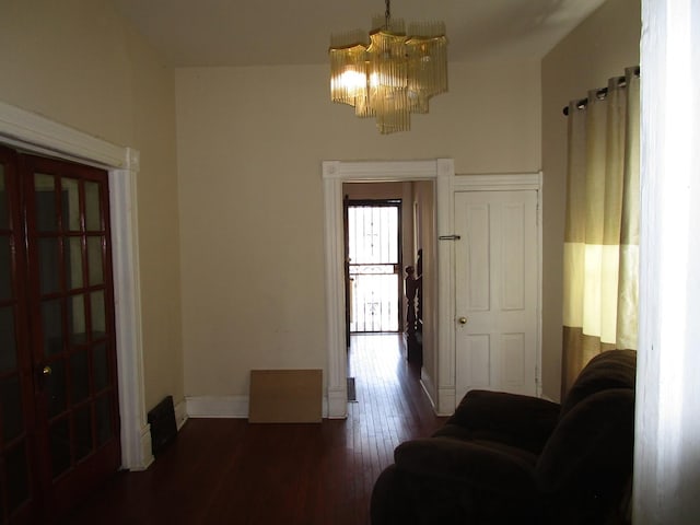 8742 S Racine Ave, Chicago, IL 60620 - sitting room with a chandelier, baseboards, and dark wood finished floors