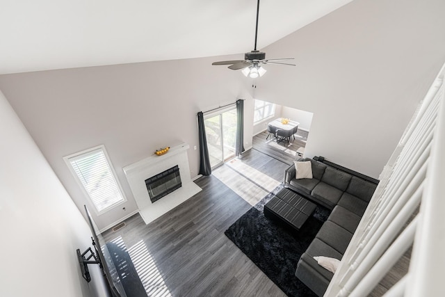 931 Old Oak Cir, Algonquin, IL 60102 - living room with high vaulted ceiling, dark wood-type flooring, ceiling fan, and a glass covered fireplace