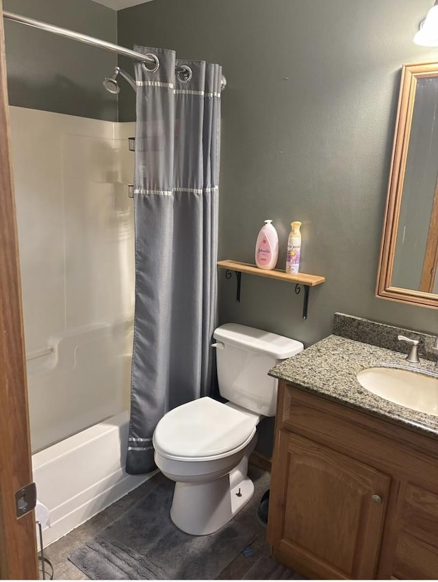 full bath with shower / bath combination with curtain, toilet, and vanity