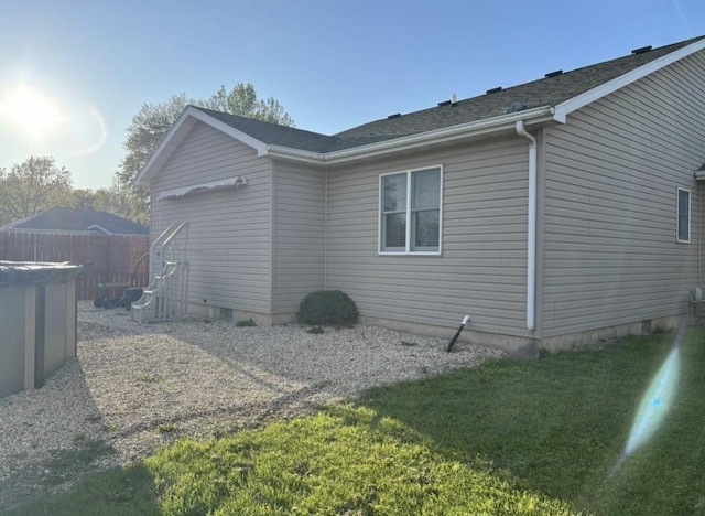 view of side of property with fence