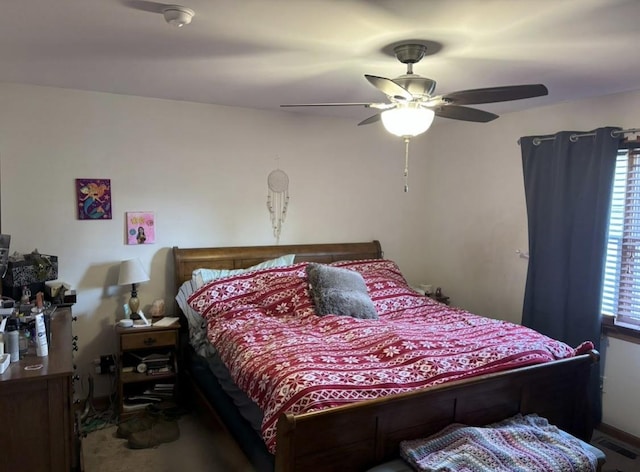 bedroom featuring a ceiling fan and visible vents