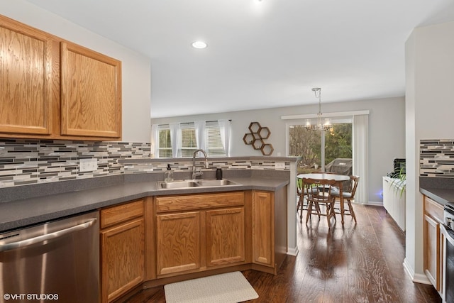 kitchen featuring dishwasher, a sink, plenty of natural light, a peninsula, and recessed lighting