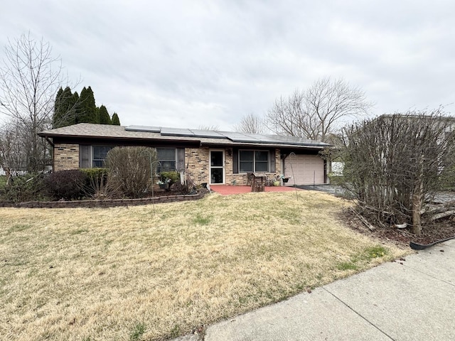 5712 Crestwood Rd, Matteson, IL 60443 - ranch-style house with an attached garage, solar panels, a front yard, and brick siding