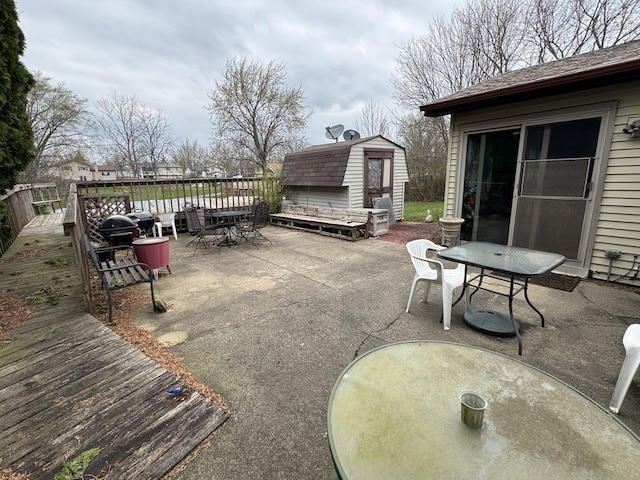 5712 Crestwood Rd, Matteson, IL 60443 - view of patio featuring outdoor dining space, an outdoor structure, a storage shed, and a wooden deck