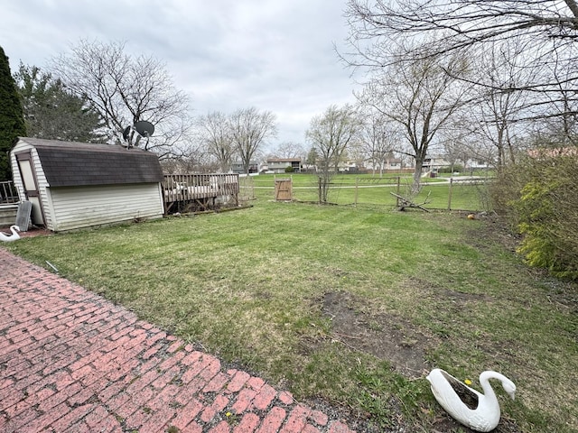 5712 Crestwood Rd, Matteson, IL 60443 - view of yard featuring a storage unit and an outbuilding