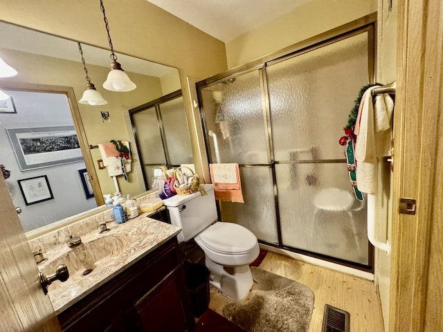 5712 Crestwood Rd, Matteson, IL 60443 - full bath with vanity, a stall shower, wood finished floors, and toilet
