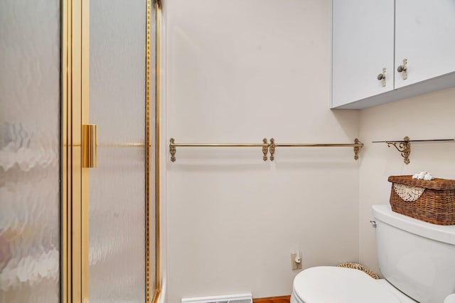 full bath featuring toilet and a shower stall