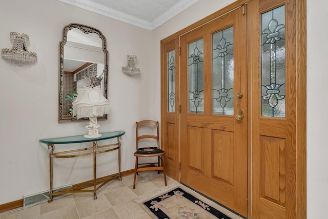 entryway featuring baseboards and ornamental molding