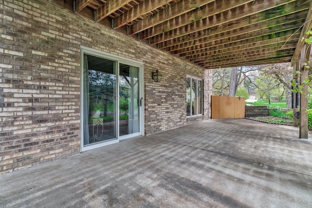 wooden deck with a patio